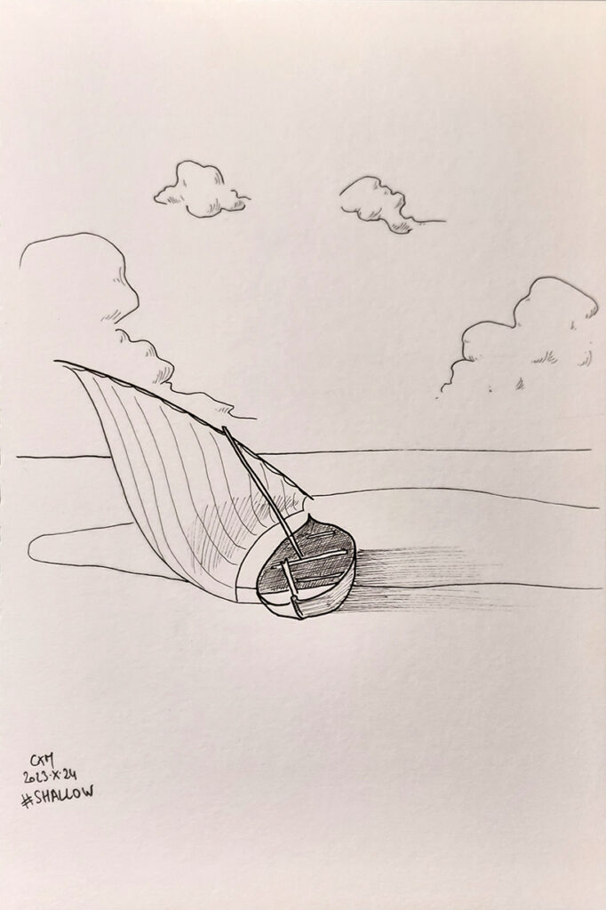 Une barque posée sur un banc de sable
