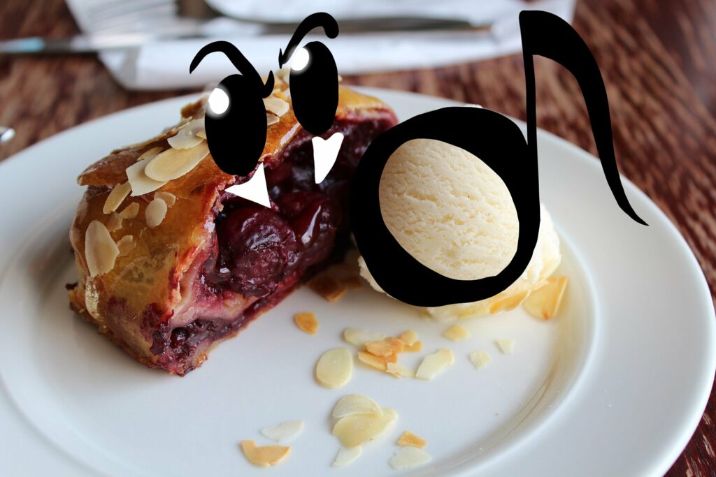 Photo d’un strudel aux fruits rouges et une boule de glace (vanille vraisemblablement) sur une assiette blanche.
Sur le strudel, j’ai peint des yeux et des dents (vite fait)
et sur la boule de glace, j’ai dessiné une note de musique croche mais au corps blanc (ce qui n’existe pas mais bon)
Photo d’origine par Deror_avi - Own work, CC BY-SA 3.0
Trouvée sur Wikimedia